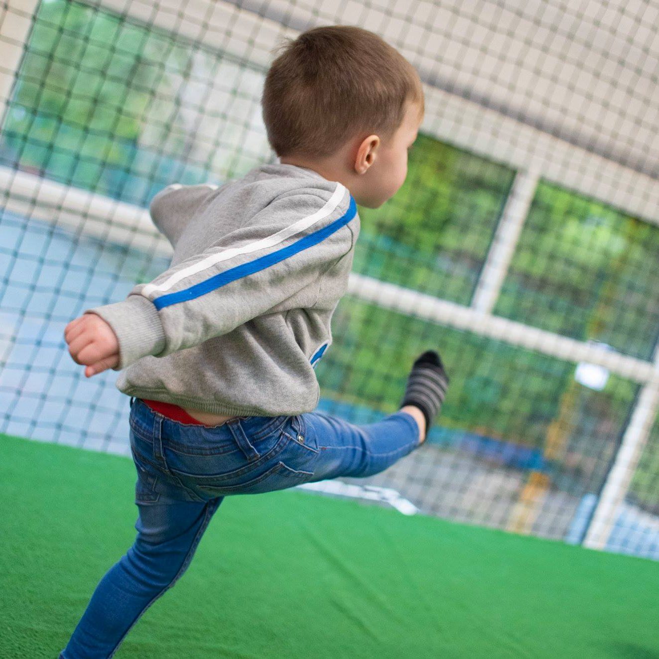 Child Playing Indoor Football